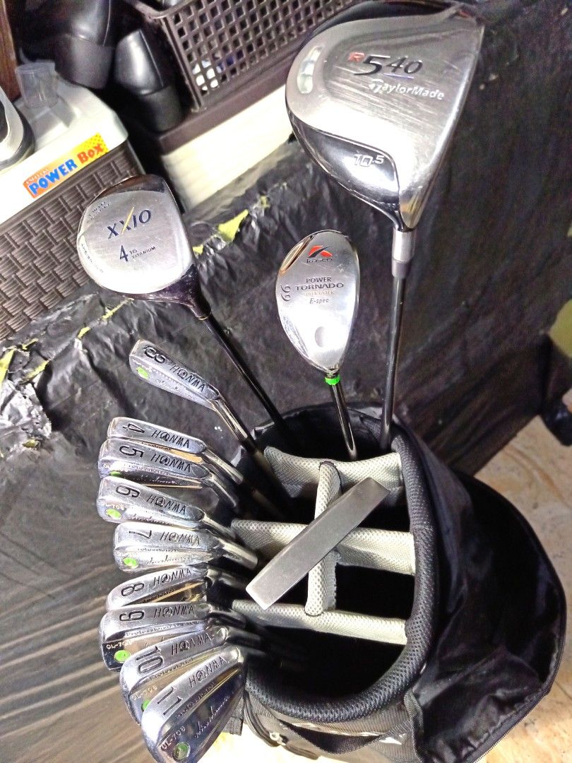 GOLF SET (Category: Golf) located in Manila. Submitted by yeonmei5614747 (Listing ID 1423806178, Image 1). Description: Complete golf club set including Honma CL-708 irons (3-11), TaylorMade r540 driver, XXIO 4 wood, Ping Putter and Snake Eyes golf bag. Includes a putter and a hybrid club. The bag is black with the Snake Eyes logo and an American flag patch. -Honma Boron S-2 Shaft -Right Handed Club. -Graphite Shaft.. -R flex.. #10 & #11 iron is 