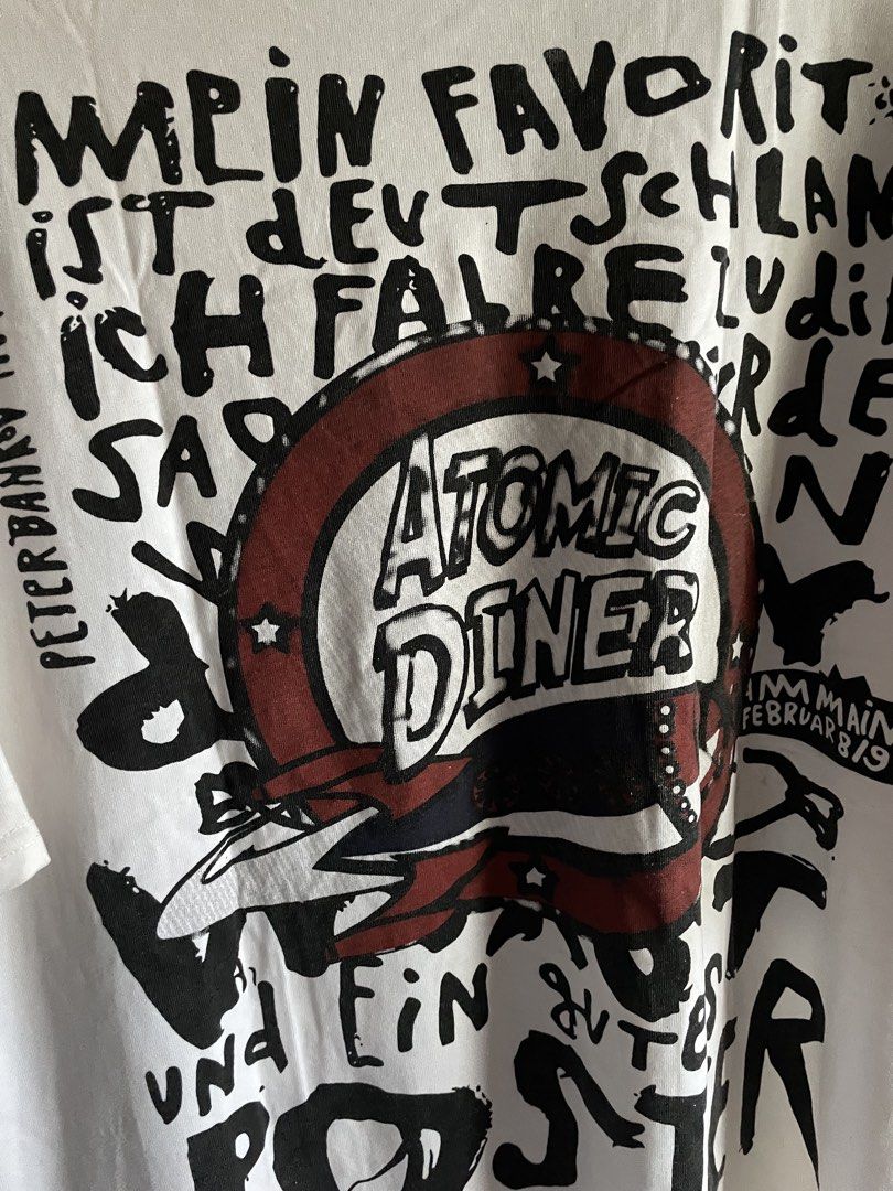 Graphic Tee (Category: Tshirts & Polo Shirts ) located in Camalig. Submitted by vvsperr (Listing ID 1423816029, Image 2). Description: size: XL (25” W 27” L) loc: albay mop: gcash condition: goods ang print, with stains.