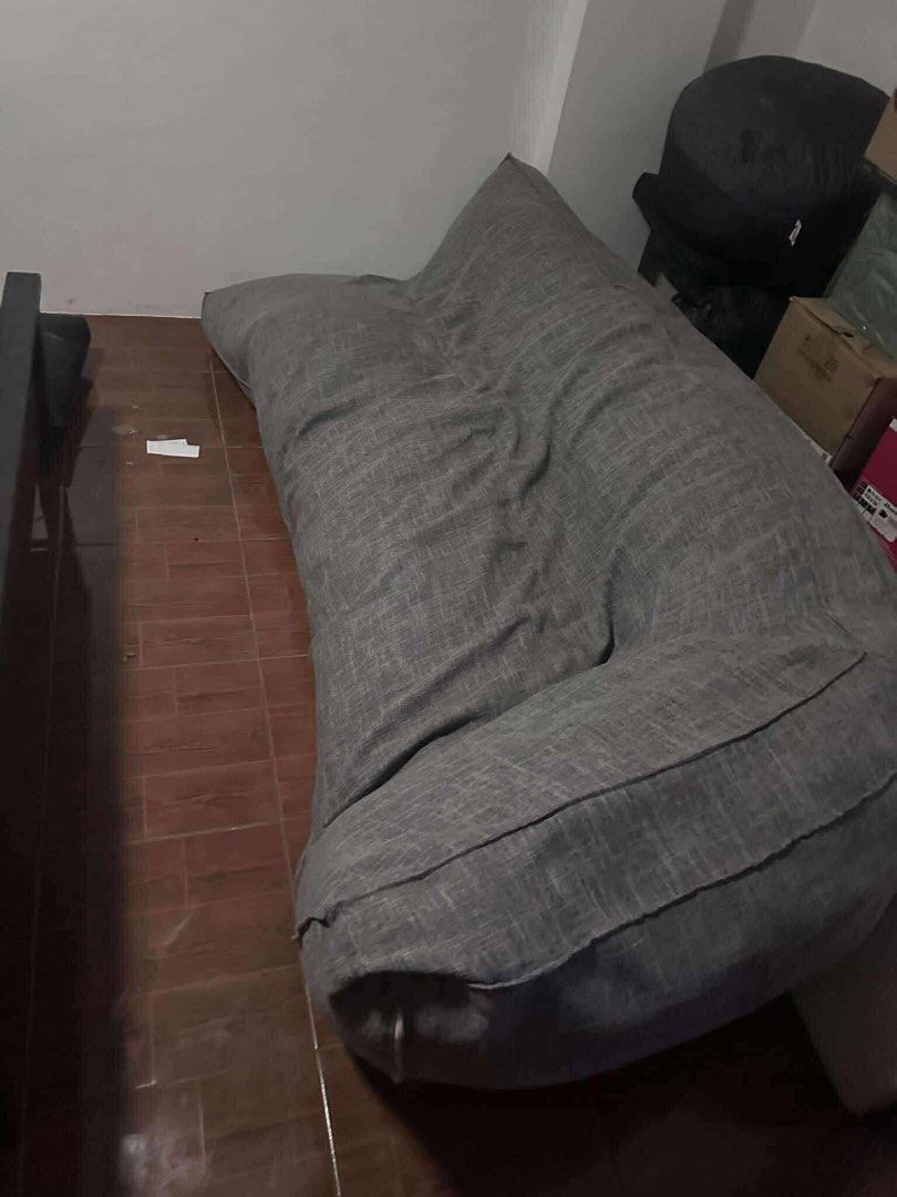 Gray Bean Bag / Floor Sofa (Category: Sofas) located in San Juan City. Submitted by faithg_ (Listing ID 1423812600, Image 1). Description: - Large gray bean bag - Made of textured fabric - Curved shape for comfortable lounging - Ideal for relaxing -negotiable .