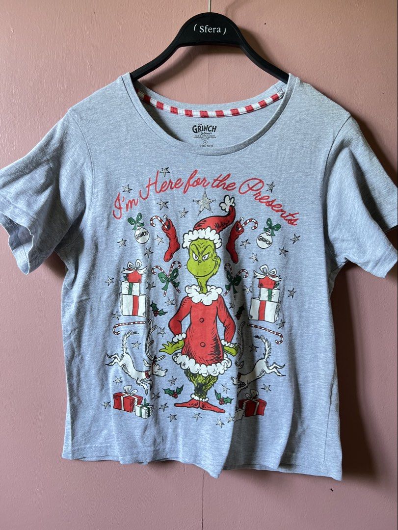 Grinch Christmas Graphic Tee - Medium (Category: Tshirts & Polo Shirts ) located in Cavite. Submitted by slumbermanila (Listing ID 1423919500, Image 1). Description: - Grinch graphic t-shirt - Features the phrase "I'm Here for the Presents" - Red and white striped neckline - Size: Medium - Brand: Love to Lounge - Made in India.