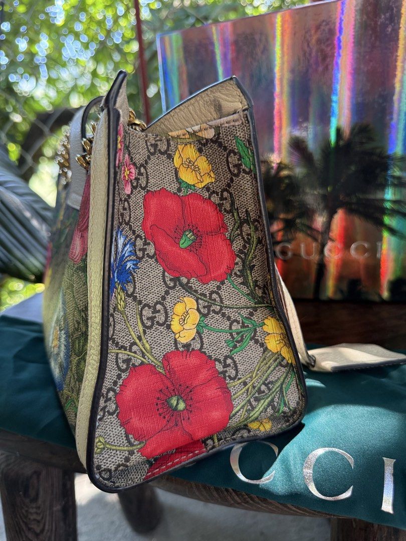 Gucci Floral Print Chain Bag (Category: Luxury Bags & Wallets) located in Manila. Submitted by fivethousandlilies (Listing ID 1423969002, Image 3). Description: - Authentic Gucci handbag with floral print - Includes original box, dust bag, and shopping bag - Features a chain strap and secure lock closure - Interior with multiple compartments for organization - Serial number visible inside - Minor wear on the strap.