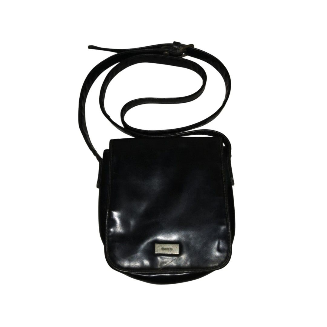 Guess Patent Leather Mini Sling Bag (Black) (Category: Luxury Accessories) located in General Mariano Alvarez. Submitted by hundred_lives (Listing ID 1423945270, Image 1). Description: Guess Patent Leather Mini Sling Bag (Black) ***Or Best Offer Wins*** Tags: burberry fendi mcm givenchy yohji yamamoto rick owens prada dolce & gabbana channel gucci hermès balenciaga valentino ralph lauren lacoste ysl bottega veneta givenchy bally y3 maison margiel