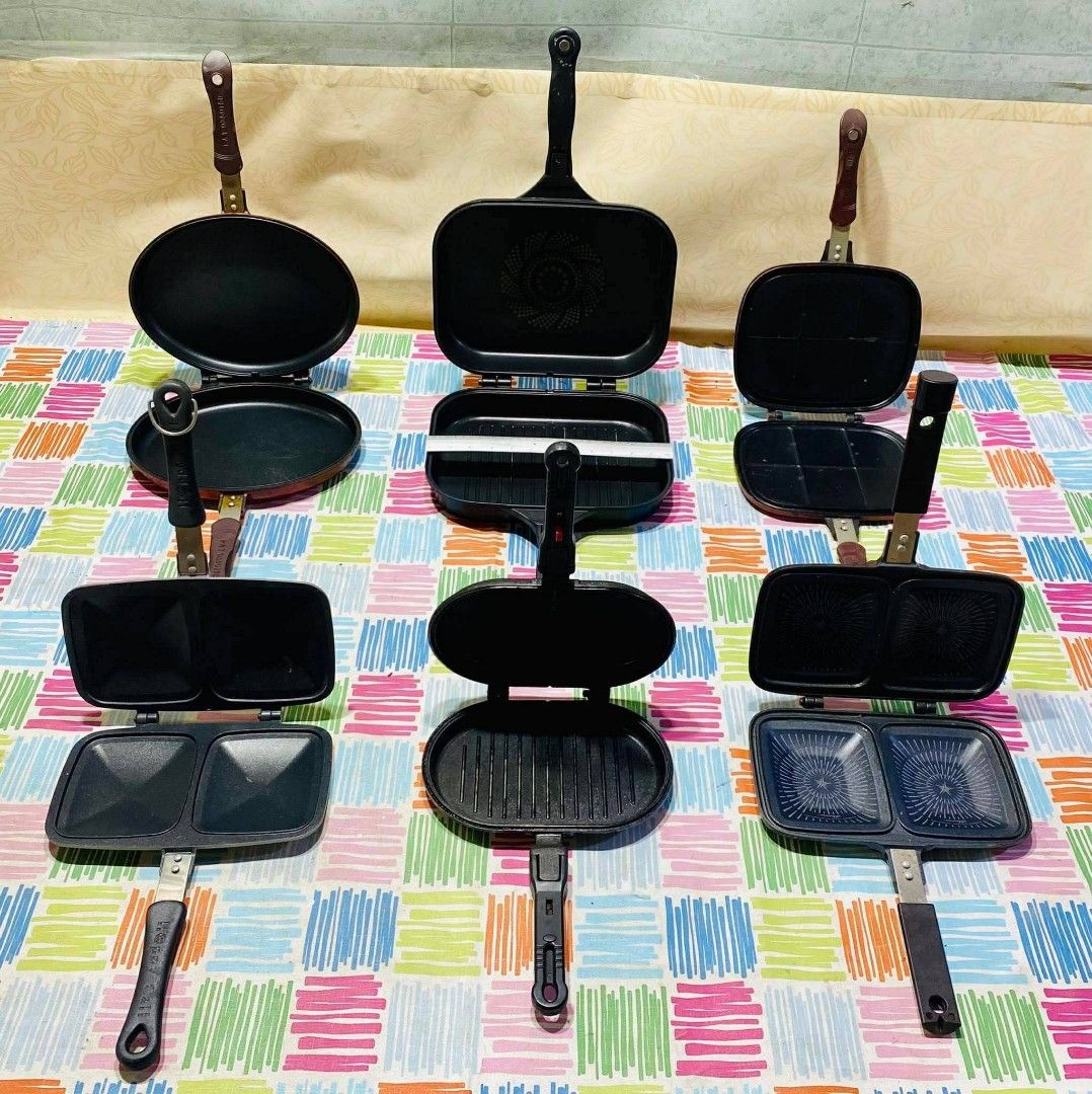 Happycall Sandwich Maker (Category: Cookware & Accessories) located in Tuguegarao City. Submitted by zealearth.27e2d4 (Listing ID 1423936481, Image 1). Description: Assorted sandwich makers with different cooking surfaces. Includes round, square, and patterned designs. Features long handles for easy handling. Some have the "Happycall" brand name visible. Perfect for making sandwiches and other grilled treats..