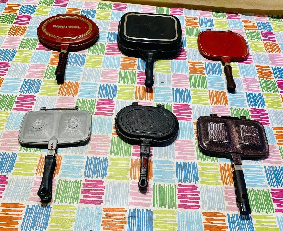 Happycall Sandwich Maker (Category: Cookware & Accessories) located in Tuguegarao City. Submitted by zealearth.27e2d4 (Listing ID 1423936481, Image 2). Description: Assorted sandwich makers with different cooking surfaces. Includes round, square, and patterned designs. Features long handles for easy handling. Some have the "Happycall" brand name visible. Perfect for making sandwiches and other grilled treats..
