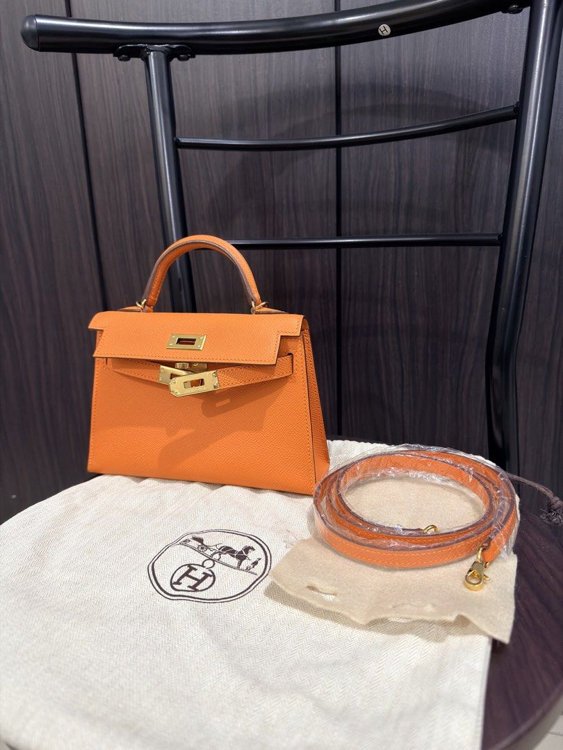 Hermès Kelly Mini Orange Apricot (Category: Luxury Bags & Wallets) located in Makati City. Submitted by holygrailbagmnl (Listing ID 1423897110, Image 2). Description: - Authentic Hermès Kelly Mini - Vibrant orange color - Top handle and detachable shoulder strap - Includes dust bag - Orange leather interior - Gold-toned hardware - Made in France.