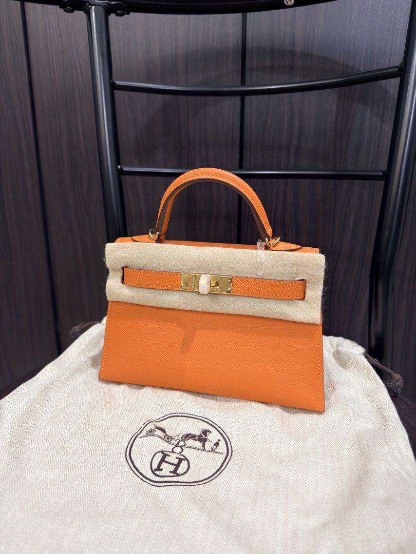 Hermès Kelly Mini Orange Apricot (Category: Luxury Bags & Wallets) located in Makati City. Submitted by holygrailbagmnl (Listing ID 1423897110, Image 3). Description: - Authentic Hermès Kelly Mini - Vibrant orange color - Top handle and detachable shoulder strap - Includes dust bag - Orange leather interior - Gold-toned hardware - Made in France.
