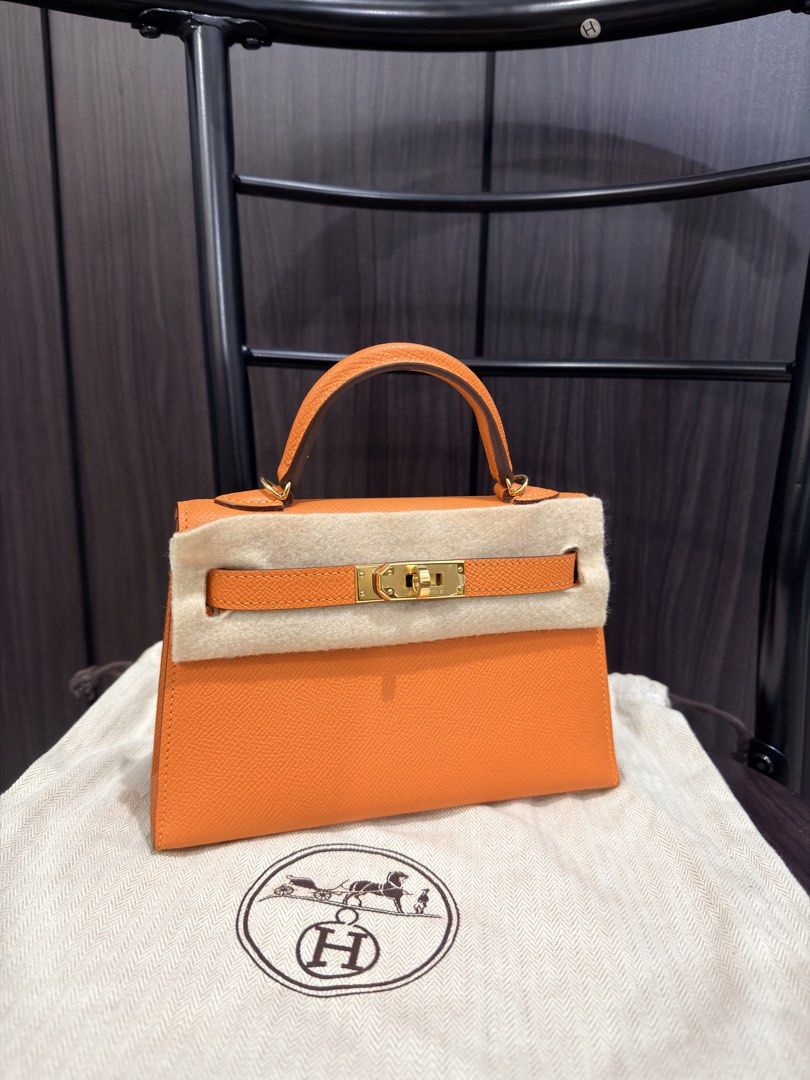 Hermès Kelly Mini Orange Apricot (Category: Luxury Bags & Wallets) located in Makati City. Submitted by holygrailbagmnl (Listing ID 1423897110, Image 1). Description: - Authentic Hermès Kelly Mini - Vibrant orange color - Top handle and detachable shoulder strap - Includes dust bag - Orange leather interior - Gold-toned hardware - Made in France.