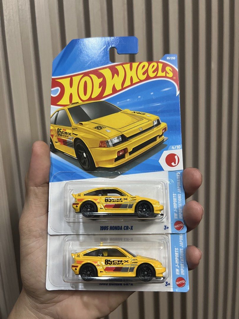 Hot Wheels 1995 Honda CR-X Case E 2026 Diecast car (Category: Vehicle & Diecast Models) located in Zamboanga. Submitted by lcomprendio26013 (Listing ID 1423915519, Image 1). Description: - Hot Wheels 1995 Honda CR-X - Color: Yellow - Features black wheels - Number "85" on the side - Part of the HW J-Imports series - Brand new in original packaging 200ea.