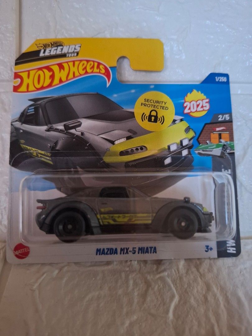 Hot Wheels Mazda MX-5 Miata (Category: Vehicle & Diecast Models) located in Narvacan. Submitted by jigger85_2ndaccount (Listing ID 1423793741, Image 1). Description: - Hot Wheels Mazda MX-5 Miata diecast car - Part of the Legends series - Sleek black with vibrant yellow accents - Features: 2/5 in the series - Includes security-protected packaging - Released in 2025.