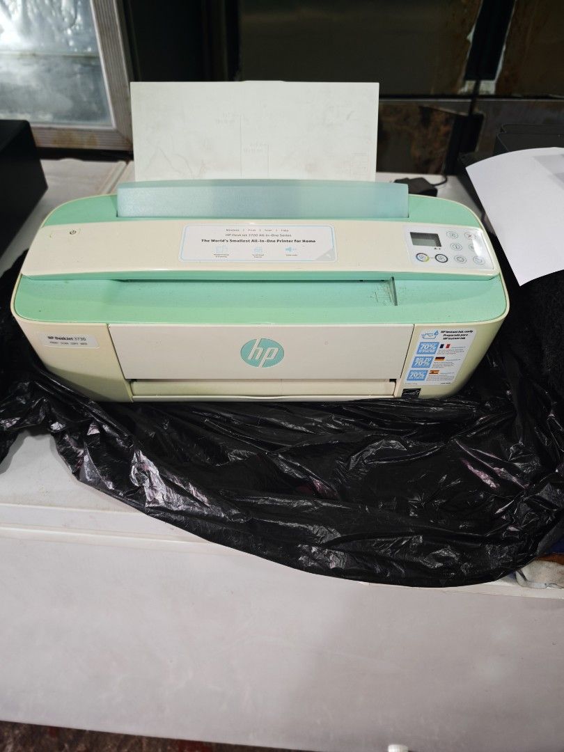 HP DeskJet 3700 Series Printer (Category: Printers, Scanners & Copiers) located in Manila. Submitted by sentengdepot (Listing ID 1423845575, Image 1). Description: - HP DeskJet 3700 series printer - White and mint green color scheme - Control panel with buttons and display - In good working condition - Features the HP logo.