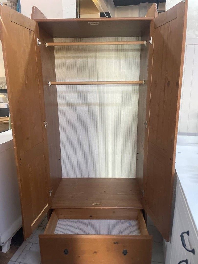 IKEA Solid Pine Wardrobe (Category: Shelves, Cabinets & Racks) located in Pasir Gudang. Submitted by izrahidris28 (Listing ID 1423967094, Image 2). Description: - IKEA solid pine wardrobe - Two doors - One drawer - Includes hanging rod - Natural wood finish - Ready for use.