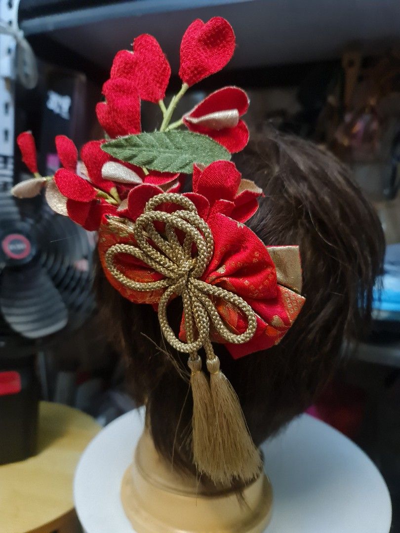 Japanese Hair Ornament (Category: Hair Accessories) located in Angeles City. Submitted by reallygraceful (Listing ID 1423911657, Image 2). Description: - Japanese hair ornament - Features red fabric flowers and gold accents - Includes a gold bow and tassel - Attaches to hair with a comb - Perfect for special occasions - Good Condition NO LOW BALLING ‼️ .