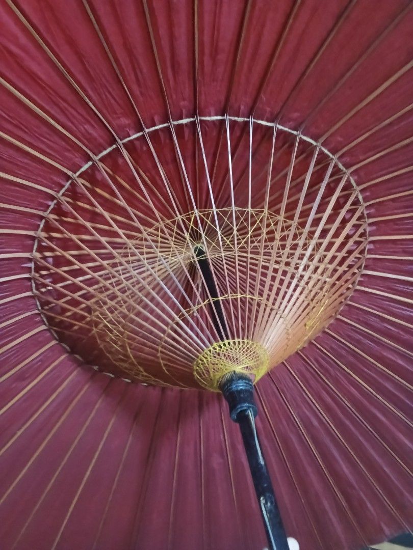 Japanese Traditional Umbrella (Category: Umbrellas) located in Caloocan City. Submitted by surplusandbnewshop (Listing ID 1423854367, Image 2). Description: - Traditional Japanese umbrella - Red paper canopy - Bamboo frame - Black handle - Decorative top - Includes original packaging - Opens and closes.