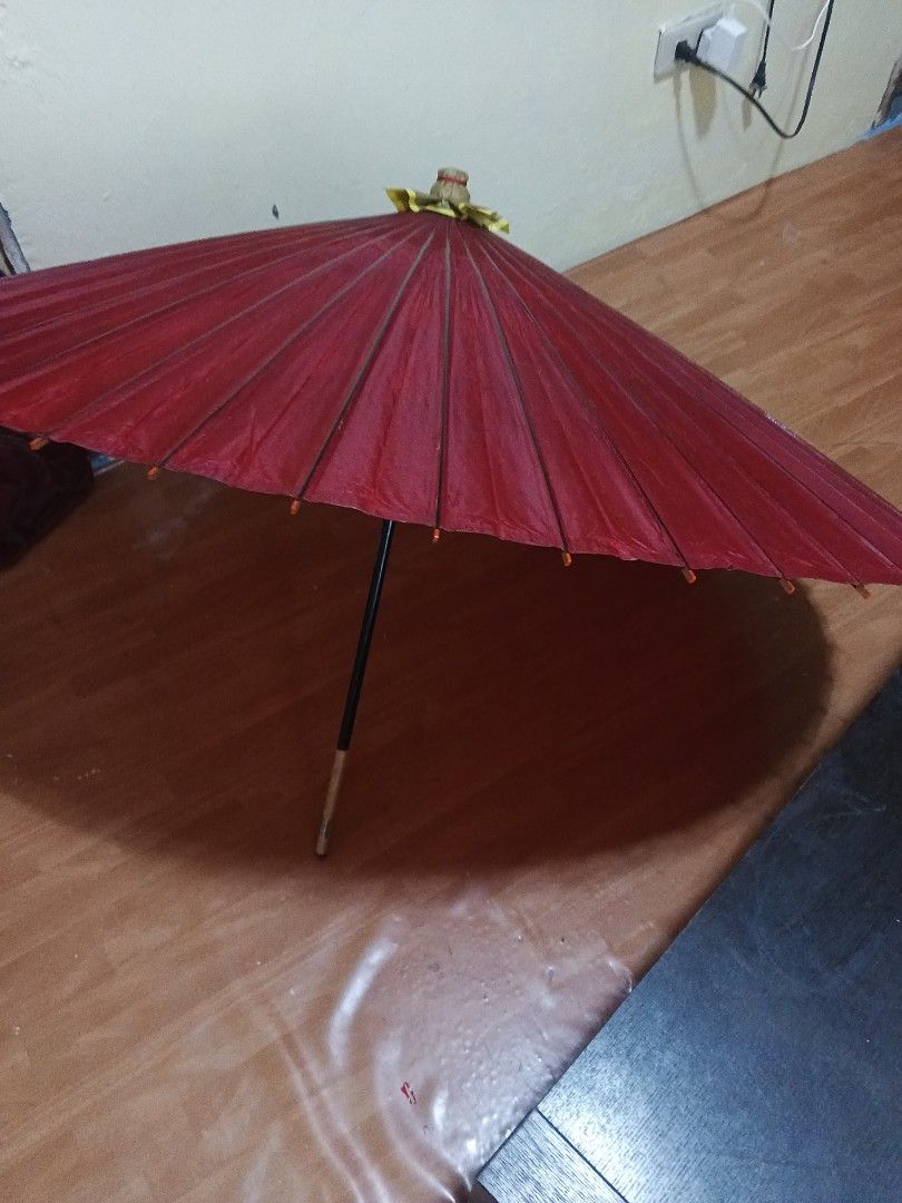 Japanese Traditional Umbrella (Category: Umbrellas) located in Caloocan City. Submitted by surplusandbnewshop (Listing ID 1423854367, Image 3). Description: - Traditional Japanese umbrella - Red paper canopy - Bamboo frame - Black handle - Decorative top - Includes original packaging - Opens and closes.
