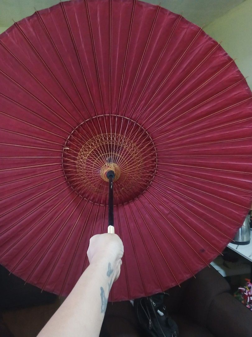 Japanese Traditional Umbrella (Category: Umbrellas) located in Caloocan City. Submitted by surplusandbnewshop (Listing ID 1423854367, Image 1). Description: - Traditional Japanese umbrella - Red paper canopy - Bamboo frame - Black handle - Decorative top - Includes original packaging - Opens and closes.