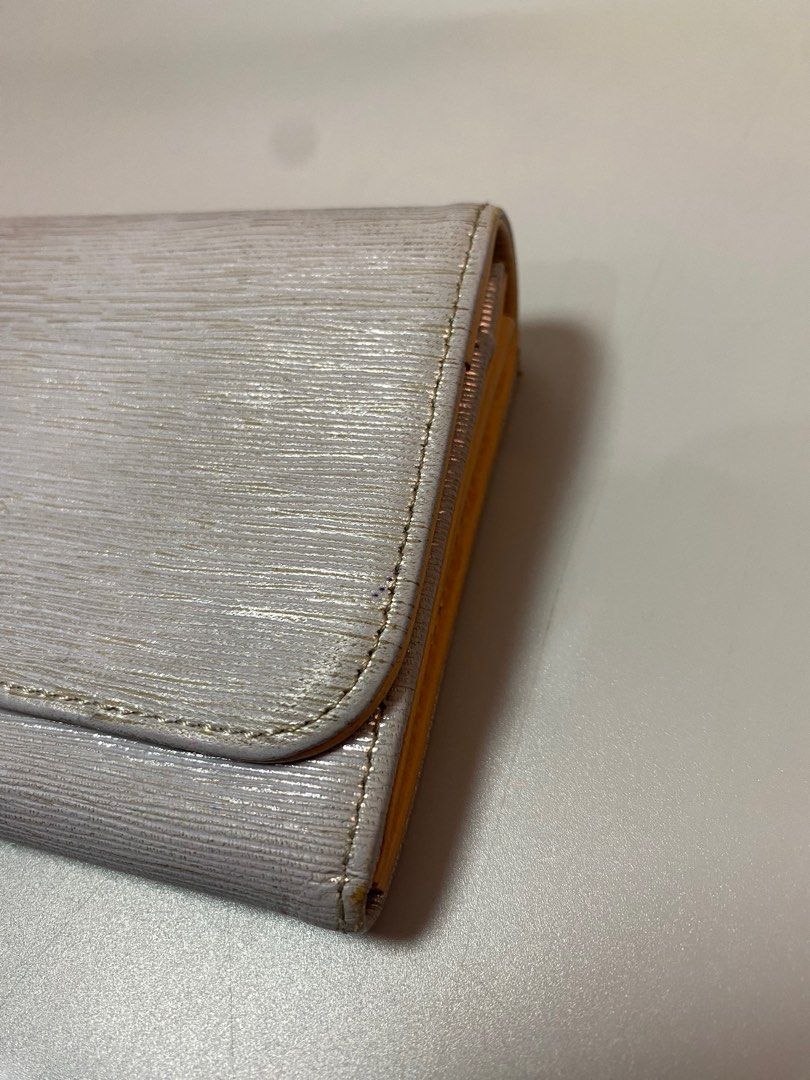 Lanvin en Bleu Long Wallet (Category: Luxury Bags & Wallets) located in Quezon City. Submitted by loloyz123 (Listing ID 1423924162, Image 3). Description: Lanvin en Bleu long wallet. Silver, textured exterior with flap and zip closure. Features card slots, zippered pocket, and Lanvin en Bleu branding. Condition: Very good Color rate: 9.8/10 Size: L:3.5 W:7.5 inches.
