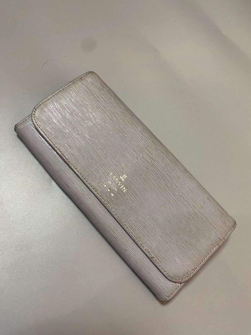 Lanvin en Bleu Long Wallet (Category: Luxury Bags & Wallets) located in Quezon City. Submitted by loloyz123 (Listing ID 1423924162, Image 1). Description: Lanvin en Bleu long wallet. Silver, textured exterior with flap and zip closure. Features card slots, zippered pocket, and Lanvin en Bleu branding. Condition: Very good Color rate: 9.8/10 Size: L:3.5 W:7.5 inches.
