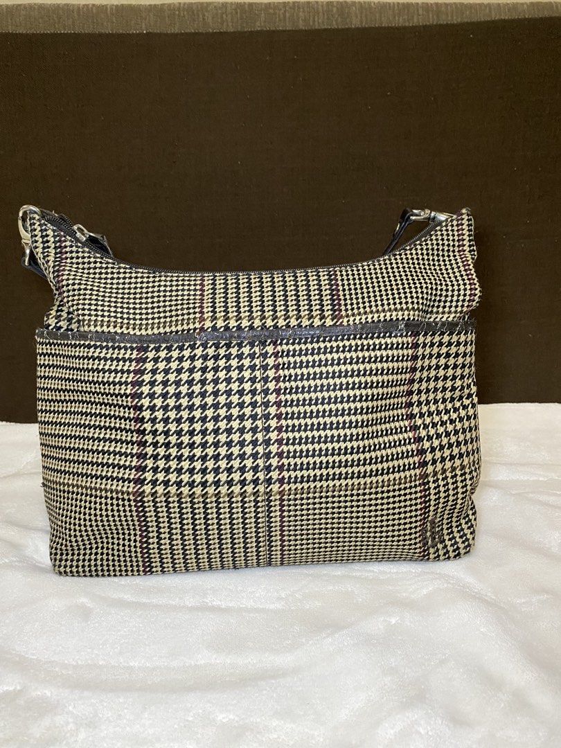 Lauren Ralph Lauren Houndstooth Shoulder Bag (Category: Luxury Bags & Wallets) located in San Antonio. Submitted by pixiechromzzz (Listing ID 1423927601, Image 1). Description: - Lauren Ralph Lauren shoulder bag - Houndstooth pattern - Zippered main compartment - Interior pocket - Brown leather trim - Shoulder strap - Brown interior lining - Handle shows wear RFS: NEEDS NEW OWNER ISSUE: LEATHER LININGS ARE CRACKED .