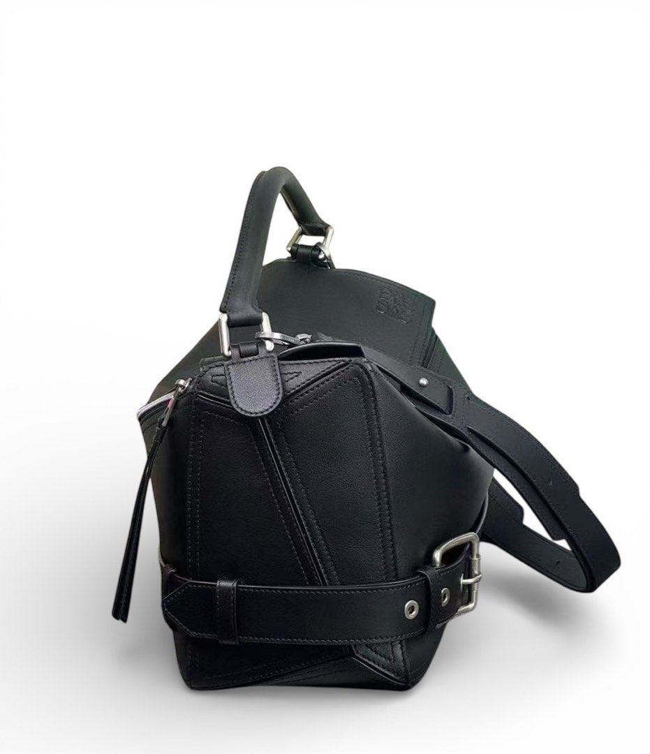 ⚜️Loewe Puzzle Bag Black Large (Category: Luxury Bags & Wallets) located in Makati City. Submitted by 90sangel (Listing ID 1423918431, Image 2). Description: •Item: Loewe Puzzle Biker bag in shiny calfskin. 🤎🕷️ •Size: large 33 x 21cm •Condition: Excellent! giftable! more detailed pictures, please DM Inclusions: Box, dustbag, paperbag, care card and loewe envelope from Loewe Japan. 🇯🇵🎌 .