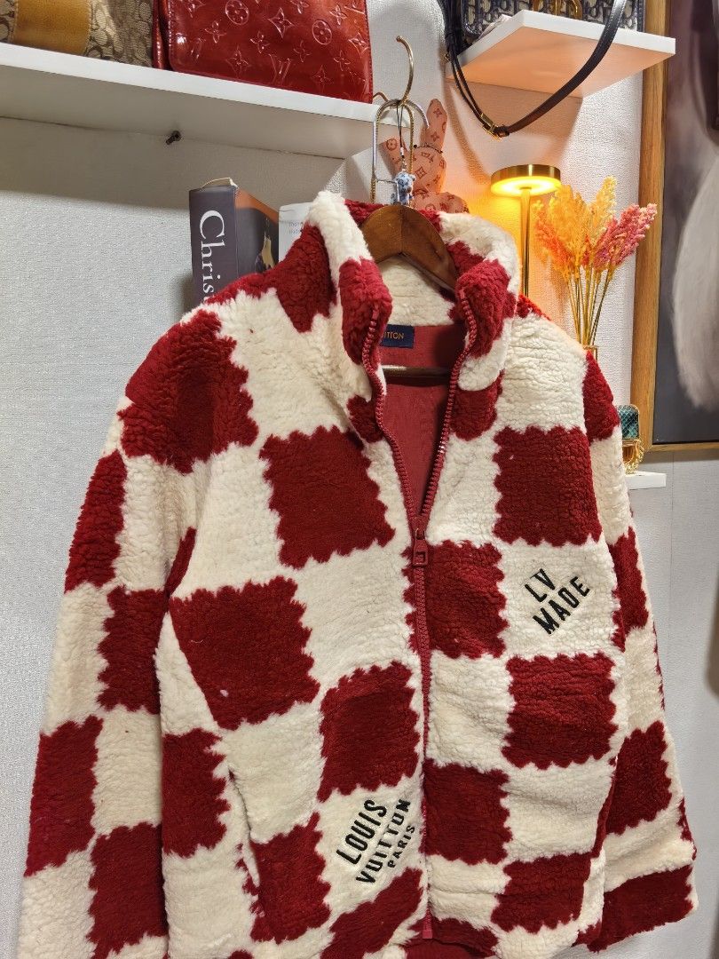 Louis Vuitton LV Made Checkerboard Jacket (Category: Luxury Apparel) located in Baguio. Submitted by ashzachary (Listing ID 1423940190, Image 3). Description: Louis Vuitton jacket features a distinctive checkerboard pattern in red and cream. It has a zip-up front, a high collar, and the "LV MADE" logo on the chest. The jacket includes the "LOUIS VUITTON PARIS" logo on the front and the zipper. The interior is red, and the jacket is made in Italy.