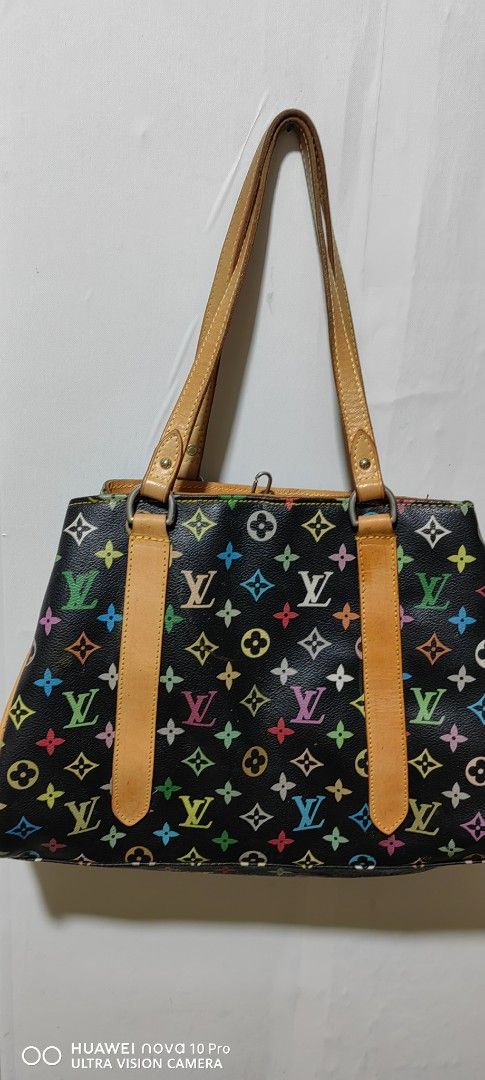 Louis Vuitton Multicolor Tote Bag (Category: Luxury Bags & Wallets) located in Bacolod City. Submitted by darriebags88 (Listing ID 1423968912, Image 2). Description: Louis Vuitton tote bag - Iconic multicolor monogram pattern - Black base with colorful LV logos - Tan leather handles and trim - Gray interior lining with zippered pocket - Buckle closure.