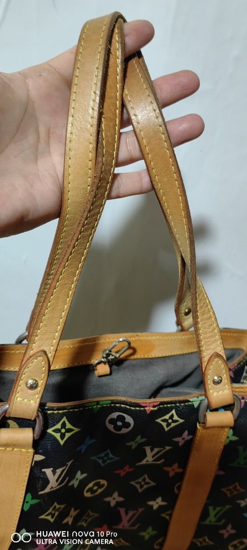 Louis Vuitton Multicolor Tote Bag (Category: Luxury Bags & Wallets) located in Bacolod City. Submitted by darriebags88 (Listing ID 1423968912, Image 3). Description: Louis Vuitton tote bag - Iconic multicolor monogram pattern - Black base with colorful LV logos - Tan leather handles and trim - Gray interior lining with zippered pocket - Buckle closure.