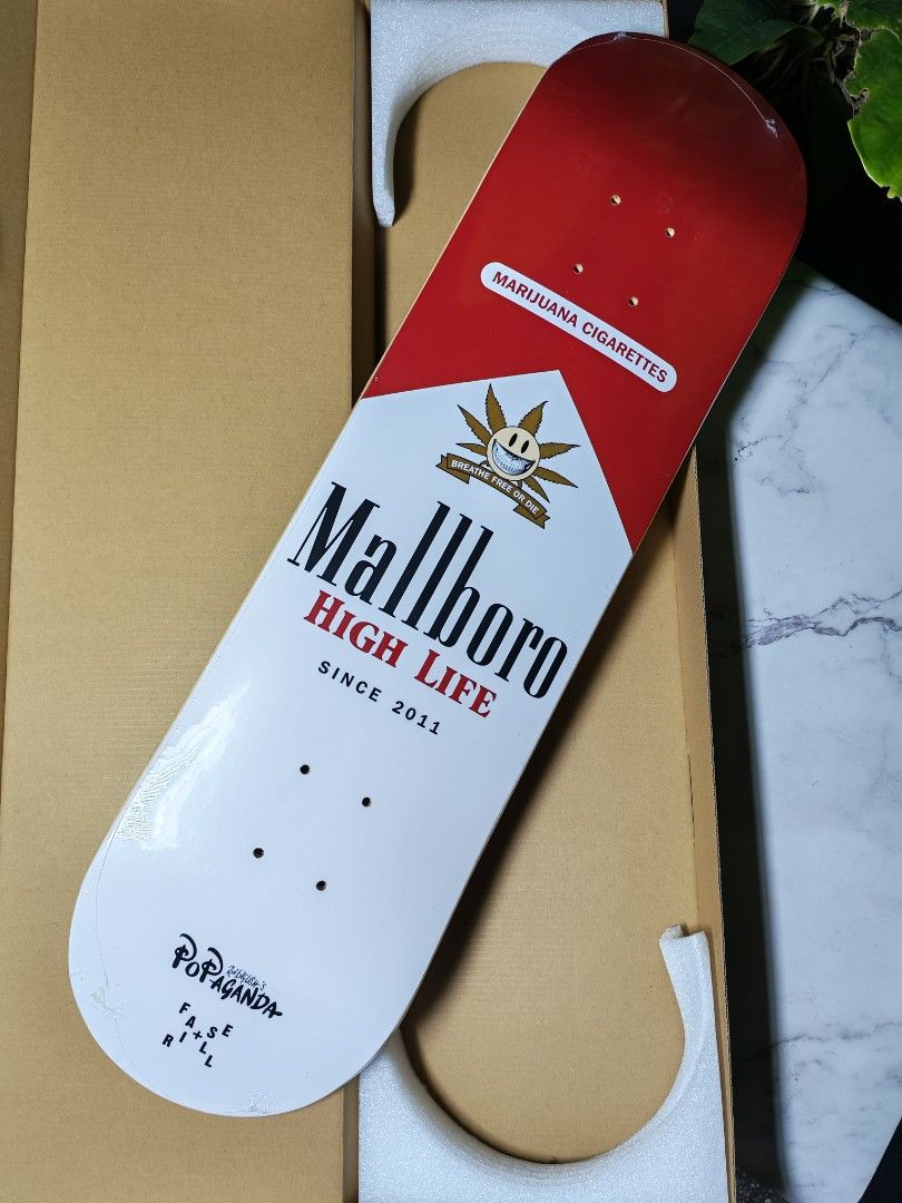 Mallboro High Life Skateboard (Category: Skates, Rollerblades & Scooters) located in Quezon City. Submitted by danilo.danilo4 (Listing ID 1423904485, Image 3). Description: - Unique skateboard design with 'Mallboro High Life' graphic. - Deck color scheme: Red and white. - Features 'Mallboro' logo and 'Marijuana Cigarettes' text. - 'Popaganda' text on the bottom of the deck. - Comes in original packaging..