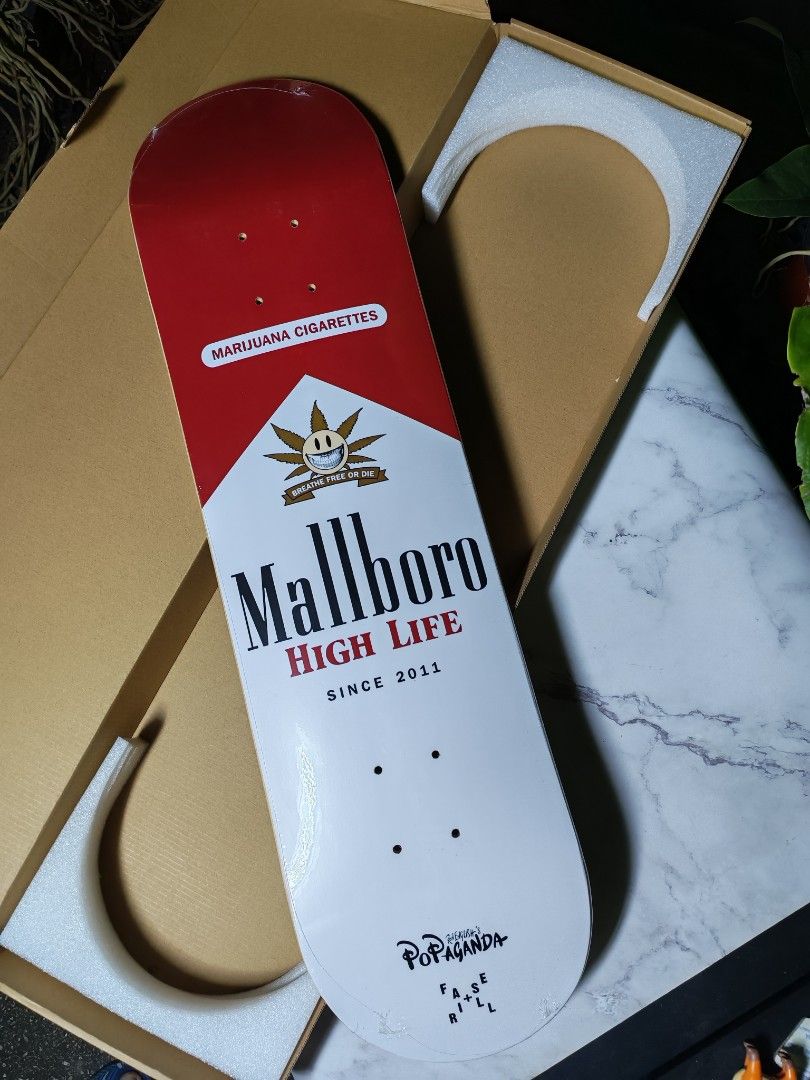 Mallboro High Life Skateboard (Category: Skates, Rollerblades & Scooters) located in Quezon City. Submitted by danilo.danilo4 (Listing ID 1423904485, Image 1). Description: - Unique skateboard design with 'Mallboro High Life' graphic. - Deck color scheme: Red and white. - Features 'Mallboro' logo and 'Marijuana Cigarettes' text. - 'Popaganda' text on the bottom of the deck. - Comes in original packaging..