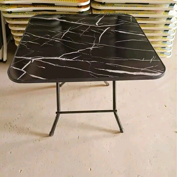 Marble Top Folding Table (Category: Tables & Sets) located in Manila. Submitted by micoooy (Listing ID 1423830877, Image 3). Description: - Stylish folding table - Marble-patterned top (white or black) - Foldable design for easy storage - Sturdy metal frame - Versatile use: side table, study table, outdoor events.