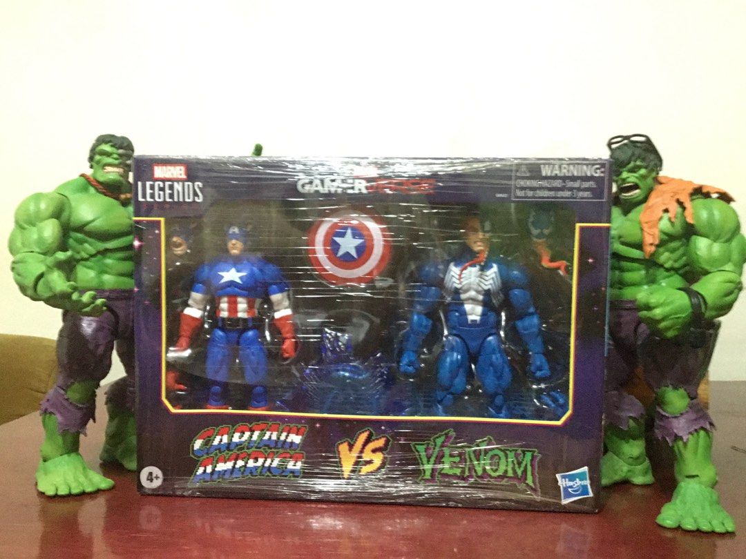 Marvel Legends Gamerverse Captain America vs Venom (Category: Figurines & Statues) located in Pasig City. Submitted by timo1407 (Listing ID 1423797619, Image 1). Description: - Marvel Legends Gamerverse action figure set - Includes Captain America figure - Includes Venom figure - Figures are in original packaging - Features Hasbro logo.