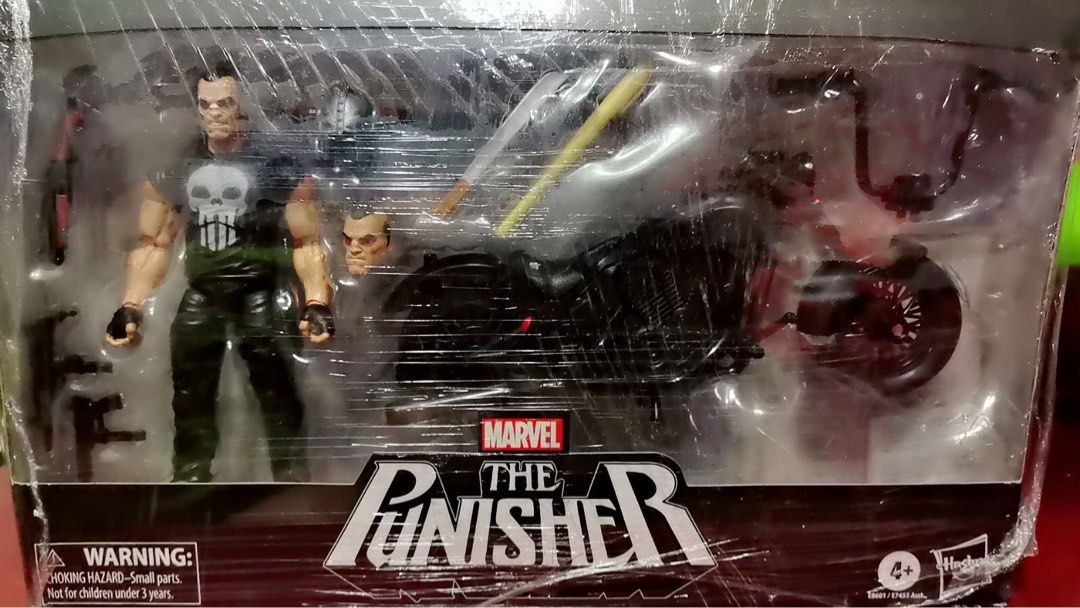 Marvel The Punisher Action Figure with Motorcycle (Category: Figurines & Statues) located in Pasig City. Submitted by timo1407 (Listing ID 1423795398, Image 1). Description: - Marvel The Punisher action figure set - Includes: - Punisher figure - Alternate head - Motorcycle - Gun - Baseball bat - Figure features skull t-shirt and black pants - Packaging with Marvel and Punisher logos - Adults collectibles .