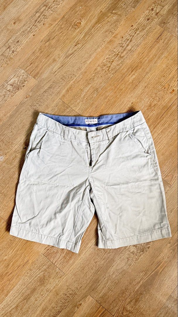 Merona Khaki Shorts (Category: Shorts) located in San Pablo. Submitted by chinitokiddd (Listing ID 1423864384, Image 1). Description: - Brand: Merona - Style: Khaki Shorts - Size: 2 - Closure: Button and zipper - Pockets: Two front pockets - Details: Blue lining on waistband - Material: 100% Cotton.
