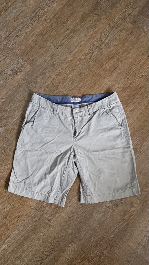 Merona Khaki Shorts (Category: Shorts) located in San Pablo. Submitted by chinitokiddd (Listing ID 1423864384, Image 2). Description: - Brand: Merona - Style: Khaki Shorts - Size: 2 - Closure: Button and zipper - Pockets: Two front pockets - Details: Blue lining on waistband - Material: 100% Cotton.