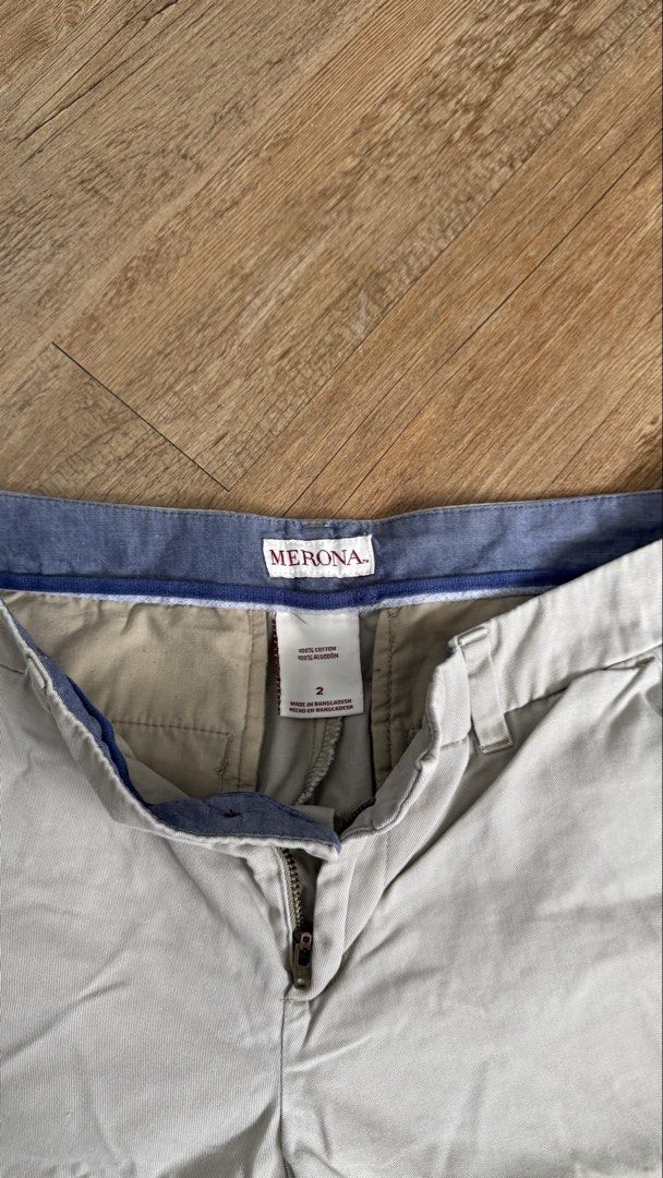 Merona Khaki Shorts (Category: Shorts) located in San Pablo. Submitted by chinitokiddd (Listing ID 1423864384, Image 3). Description: - Brand: Merona - Style: Khaki Shorts - Size: 2 - Closure: Button and zipper - Pockets: Two front pockets - Details: Blue lining on waistband - Material: 100% Cotton.