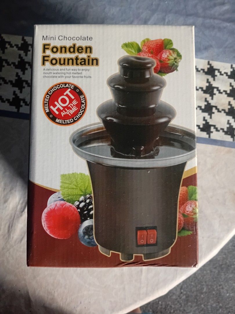 Mini Chocolate Fondue Fountain (Category: Other Kitchenware & Tableware) located in Cainta. Submitted by 2ndhandtoGo (Listing ID 1423882549, Image 1). Description: - Mini chocolate fondue fountain - Perfect for parties or home use - Easy to use with a power switch - Designed for hot melted chocolate - Great for dipping fruits and more!.