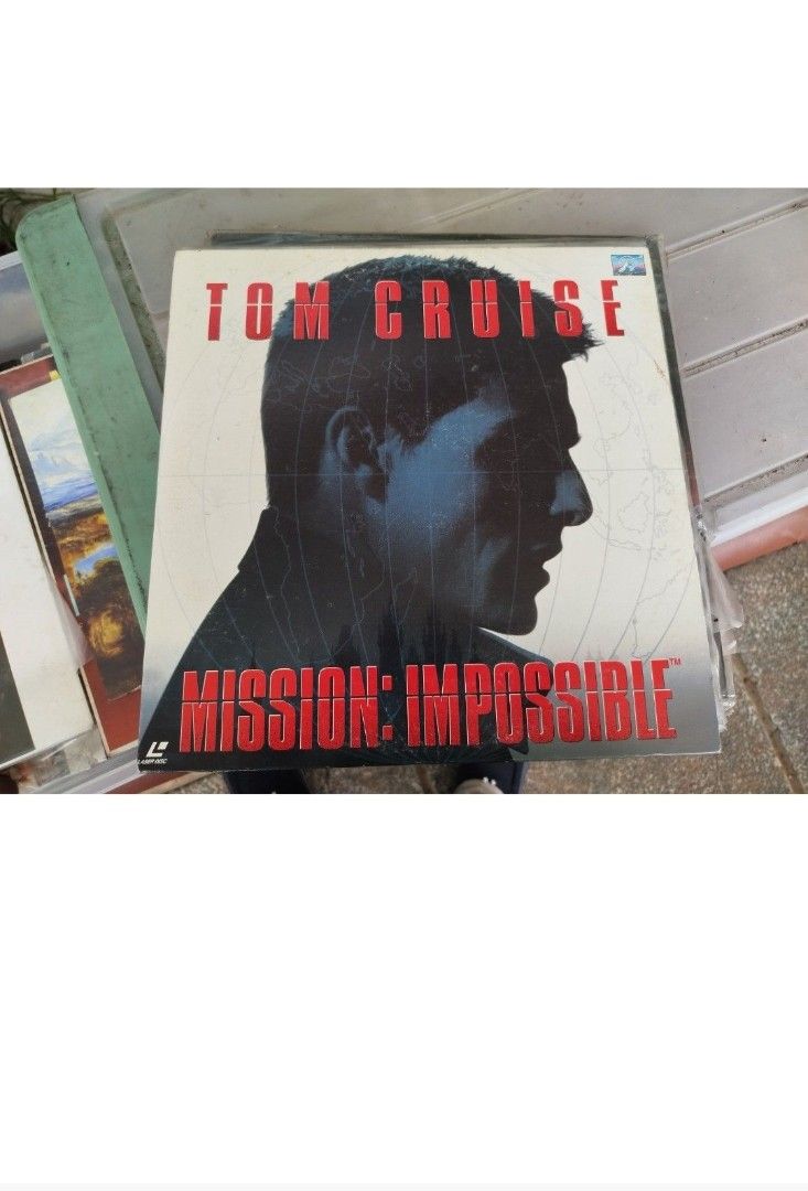 Mission: Impossible laserdisc (Category: Others) located in Caloocan City. Submitted by toys_r_here (Listing ID 1423876206, Image 1). Description: - Original PC game: Mission: Impossible - Features Tom Cruise - Classic PC game - Box art features Tom Cruise's silhouette - Box has some wear and tear - Game condition likely good.