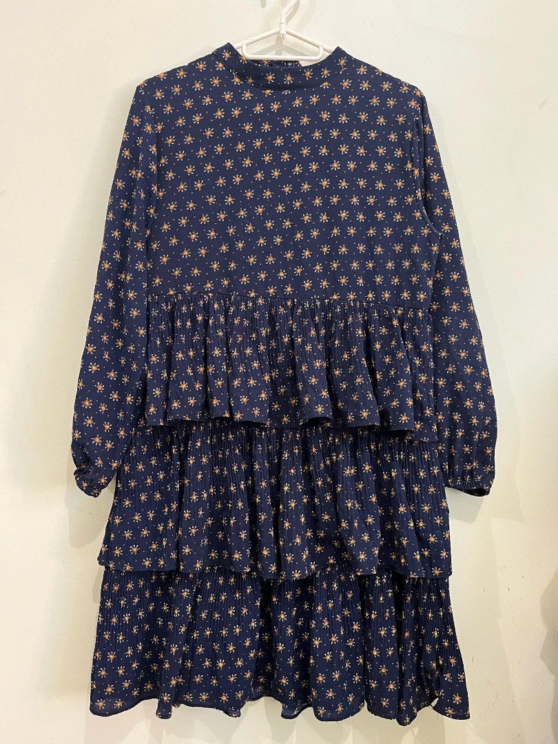 Navy Blue Tiered Dress (Category: Dresses) located in Quezon City. Submitted by jarsonjae (Listing ID 1423853163, Image 1). Description: - Navy blue tiered dress - Features a star-like pattern - High neckline - Long sleeves - Relaxed fit - Lightweight fabric - Waist up to 36.