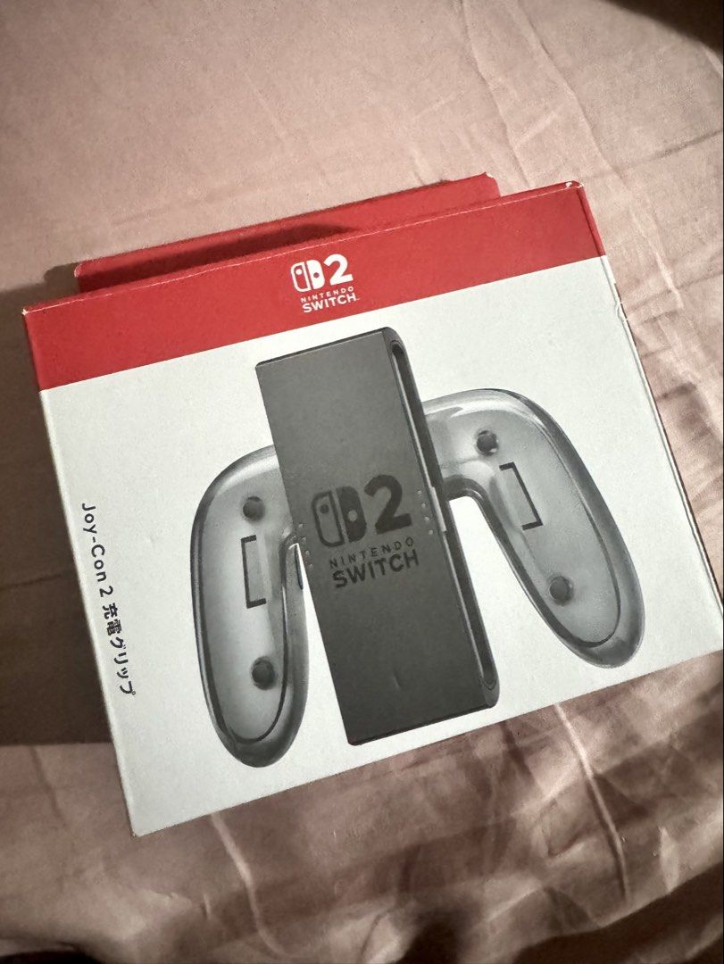 Nintendo Switch Joy-Con 2 Charging Grip (Category: Controllers) located in Makati City. Submitted by lalavs03 (Listing ID 1422651303, Image 1). Description: For Sale: Nintendo Switch 2 Joy Con Charging Grip Condition: New Complete with box and receipt from Datablitz RFS: Downsizing tech DM if interested Meetup: Alabang, Makati.
