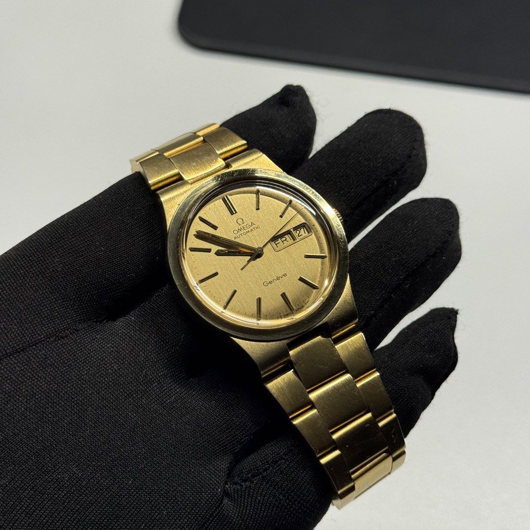 Omega Geneve Automatic Day-Date Gold Watch (Category: Luxury Watches) located in Manila. Submitted by vantageph_02 (Listing ID 1423790249, Image 1). Description: - Omega Geneve automatic watch - Gold dial - Day and date display - Gold bracelet - Omega logo on clasp and case back 36mm case size 166.0174 Newly serviced All original Pristine dial Fits up to 8" wrist size 6 months service warranty ₱55,000.