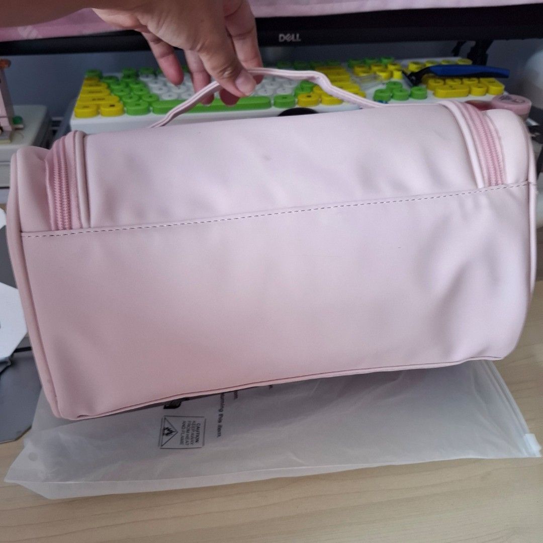 Pink Storage Bag 31.5cm (Category: Storage Boxes & Baskets) located in Quezon City. Submitted by an.marie (Listing ID 1423830676, Image 3). Description: Hey there, beauty enthusiasts! 👋 Check out this super cute Pink Travel Makeup Organizer! It's perfect for keeping all your essentials organized, whether you're traveling or just need a tidy space at home. The lovely pink color is so chic, and the design is really practical with multiple compartm