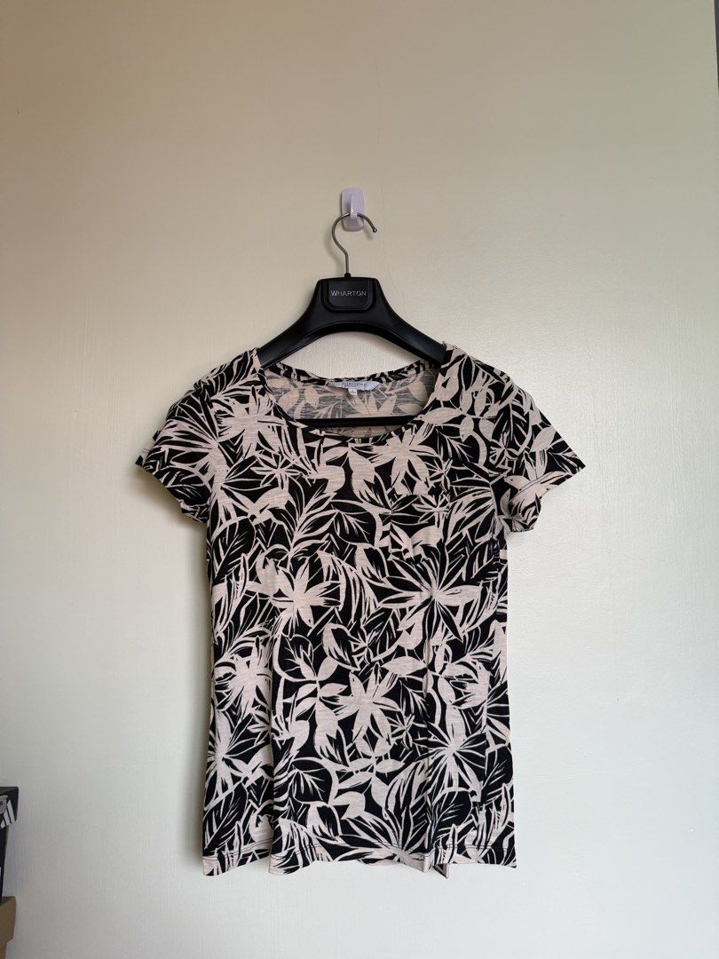 Principles Petite Floral T-shirt (Category: Shirts) located in Manila. Submitted by heiheiha04 (Listing ID 1423824762, Image 1). Description: - Principles Petite T-shirt - Black and white floral pattern - Round neckline - Short sleeves - Size: Petite 6 - Lightweight fabric - Suitable for warm weather - Dress up or down.