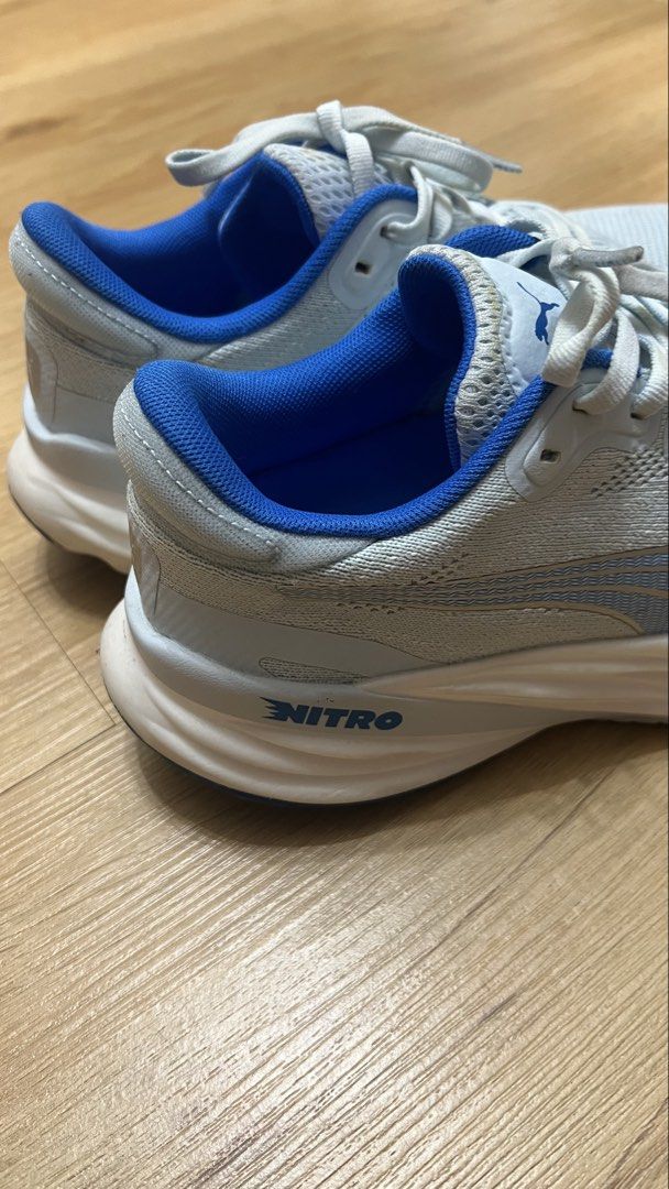 Puma Nitro Running Shoes - Blue (Category: Sneakers) located in Manila. Submitted by kuroean (Listing ID 1423817083, Image 2). Description: - Puma Nitro running shoes - Color: Blue and white - Size: US Wn's 8.5, UK 6, EUR 39, CM 25 - Blue interior - Puma logo on the side - PumaGrip sole - Made in Vietnam.