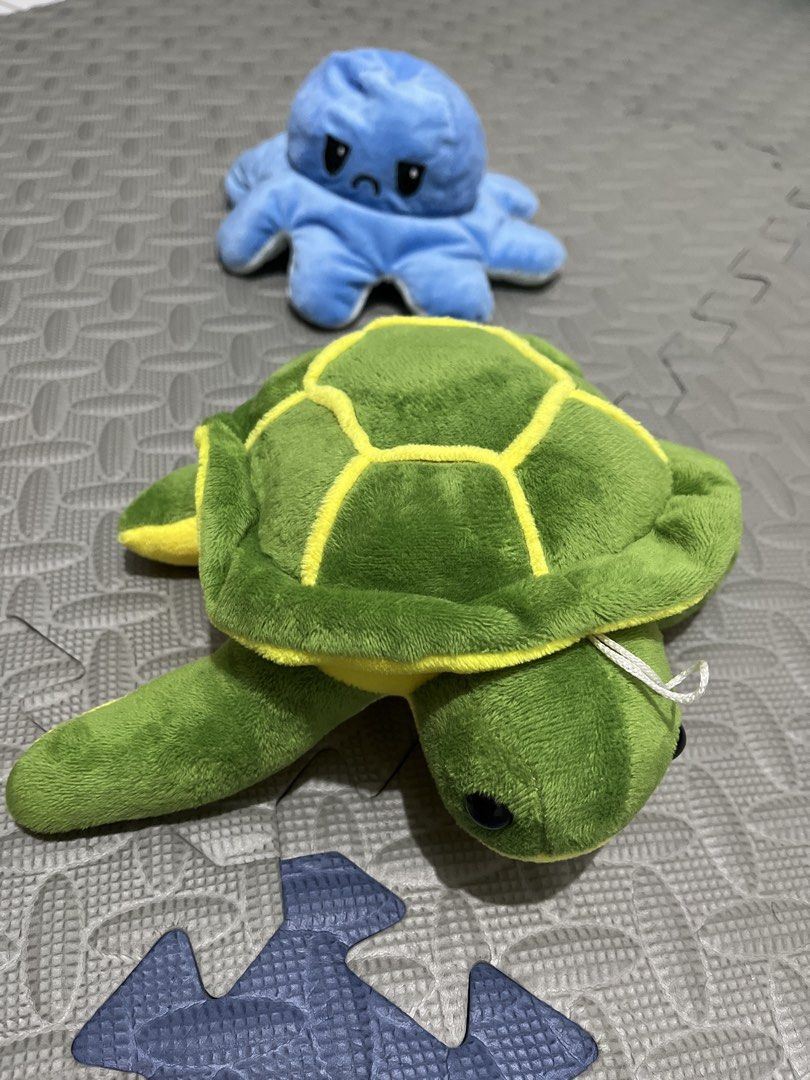 Reversible Octopus and Turtle Plushies Bundle (Category: Plushies & Soft Toys) located in Caloocan City. Submitted by graaaaah13 (Listing ID 1423948939, Image 1). Description: - Reversible plush toy: Octopus and Turtle! - Octopus: Blue with a sad face. - Turtle: Green with a yellow shell pattern. - Soft and cuddly material. - Perfect for kids and collectors!.