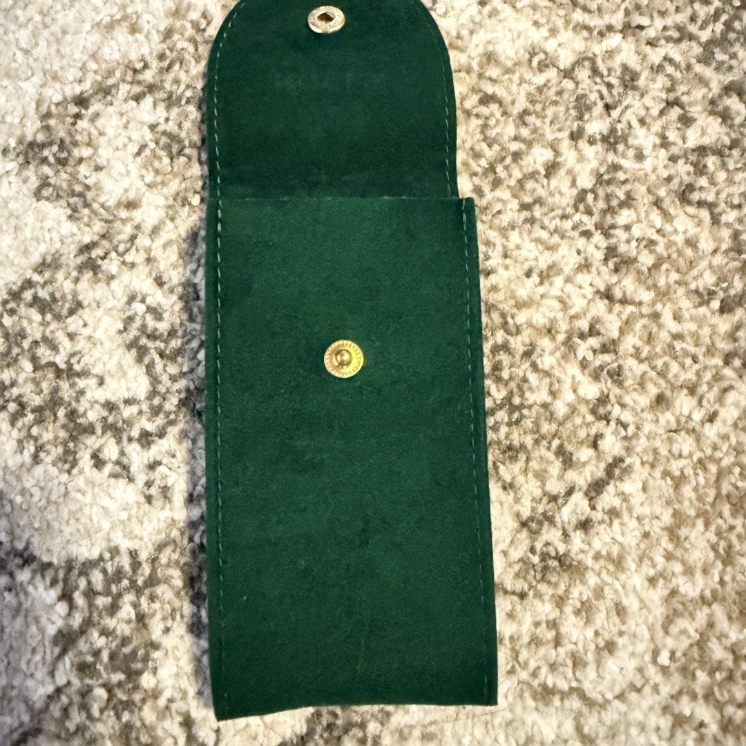 Rolex Green Velvet Watch Pouch (Category: Luxury Watches) located in Cavite. Submitted by rcmontoya (Listing ID 1423880473, Image 3). Description: - Genuine Rolex velvet green watch pouch - Features the Rolex logo - Soft interior lining - Snap closure - Serial number: "50006036.64".