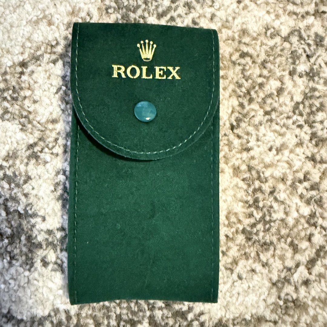 Rolex Green Velvet Watch Pouch (Category: Luxury Watches) located in Cavite. Submitted by rcmontoya (Listing ID 1423880473, Image 1). Description: - Genuine Rolex velvet green watch pouch - Features the Rolex logo - Soft interior lining - Snap closure - Serial number: "50006036.64".