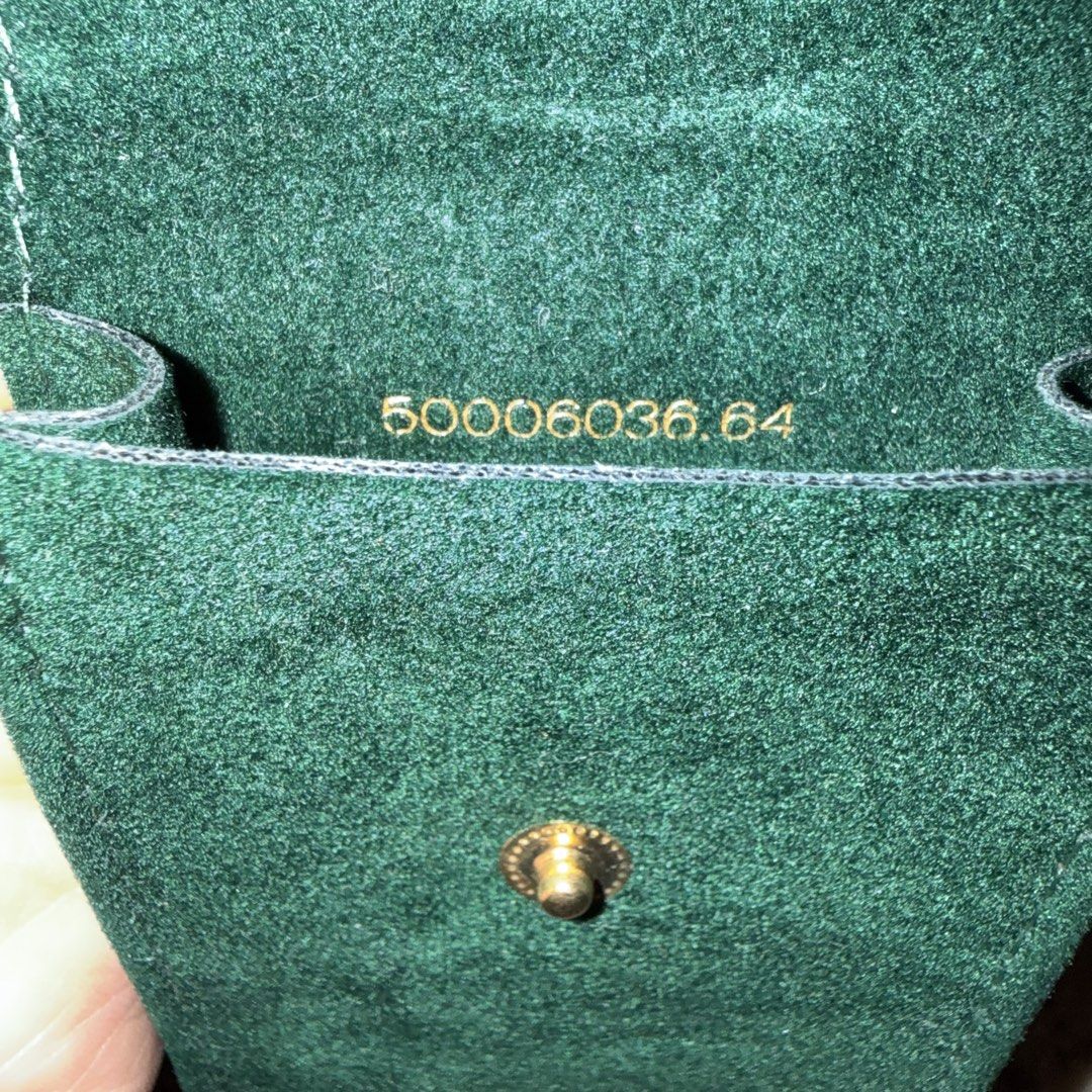 Rolex Green Velvet Watch Pouch (Category: Luxury Watches) located in Cavite. Submitted by rcmontoya (Listing ID 1423880473, Image 2). Description: - Genuine Rolex velvet green watch pouch - Features the Rolex logo - Soft interior lining - Snap closure - Serial number: "50006036.64".