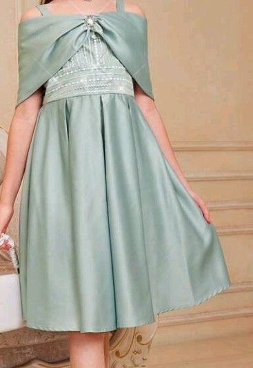Sage Green Formal Dress (Category: Dresses) located in Pasay City. Submitted by reginaidea (Listing ID 1423891081, Image 1). Description: - Elegant sage green formal dress - Unique off-shoulder design - Decorative embellishment at the neckline - Fitted bodice - Detailed waistline - Flowing skirt - Perfect for special occasions nag suot 13 years old..