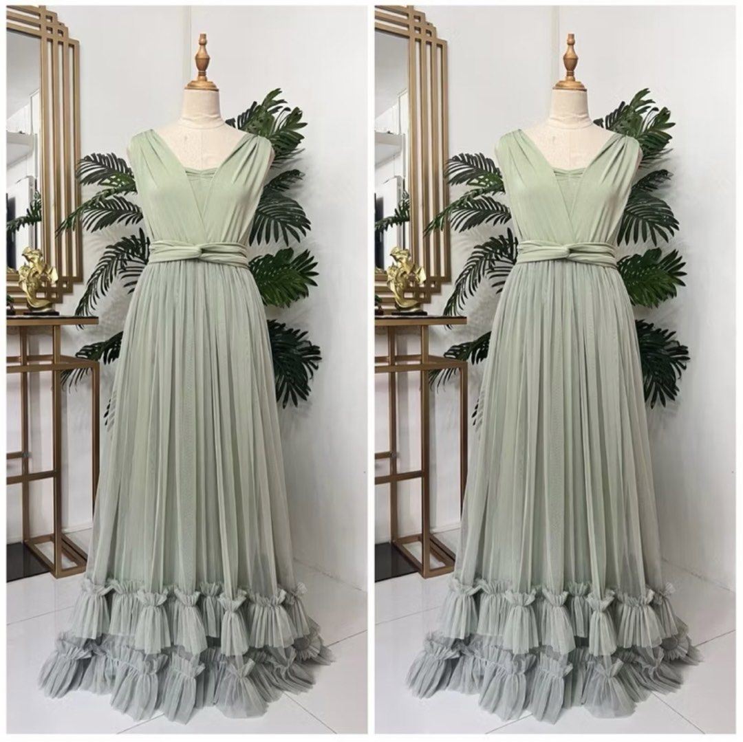 Sage Green Infinity Dress with Ruffles (Category: Dresses) located in Makati City. Submitted by sixelaa (Listing ID 1423815609, Image 1). Description: - Sage green maxi dress - Features a V-neckline - Pleated skirt design - Flowing skirt with layered ruffles - Fitted bodice - Perfect for formal events and special occasions - can transform neckline.