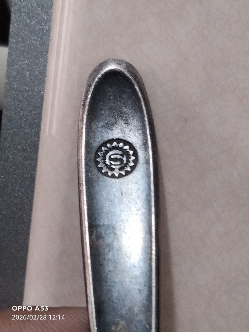 Simeone Italy Silver Spoon (41.8 grams) (Category: Dinnerware & Cutlery) located in Carmona. Submitted by rpute (Listing ID 1423820774, Image 3). Description: - Vintage Simeone Italy spoon. - Made of silver. - Detailed handle design. - Features a sun-like logo. - Classic spoon shape. - Ideal for collectors of vintage cutlery..