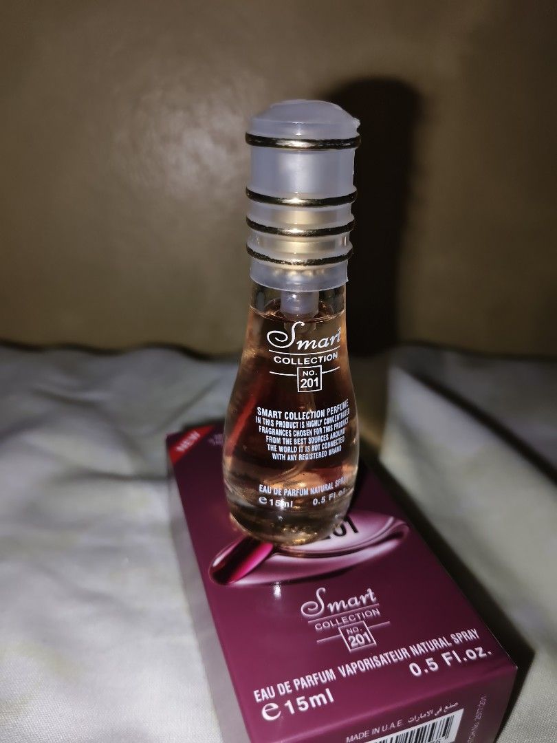 Smart Collection No. 201 Women (Category: Fragrance & Deodorants) located in Pasig City. Submitted by vianxa (Listing ID 1423860464, Image 2). Description: Brand new, medyo may dents lang yung box but the perfume it self is all goods. The "Smart Collection No. 201" perfume shown in the image is a dupe likely inspired by the Calvin Klein Euphoria Women Eau de Parfum. The scent is a captivating and luxurious floral oriental fragrance known for its 